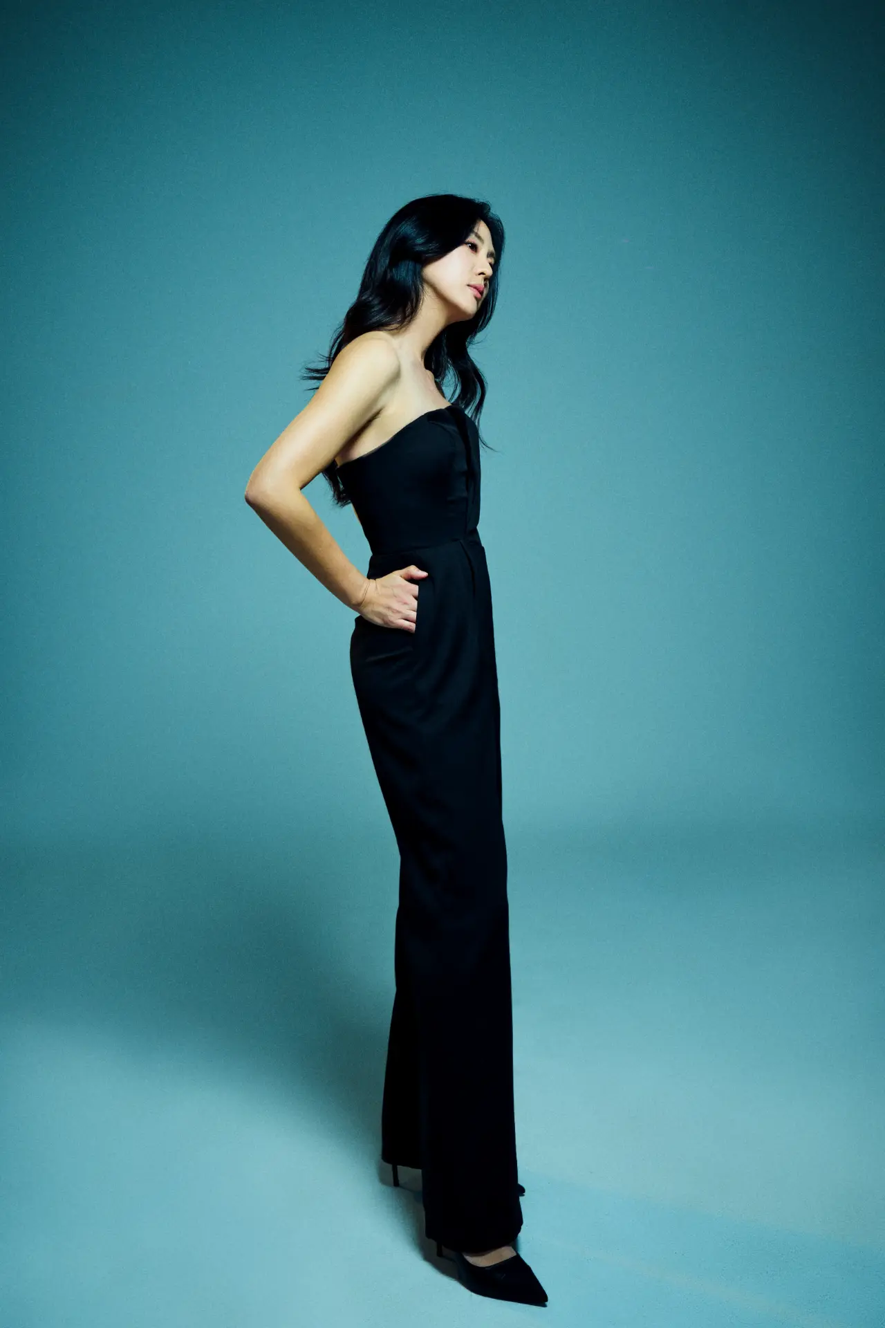 Michelle Jean Kim in a black gown, editorial studio portrait